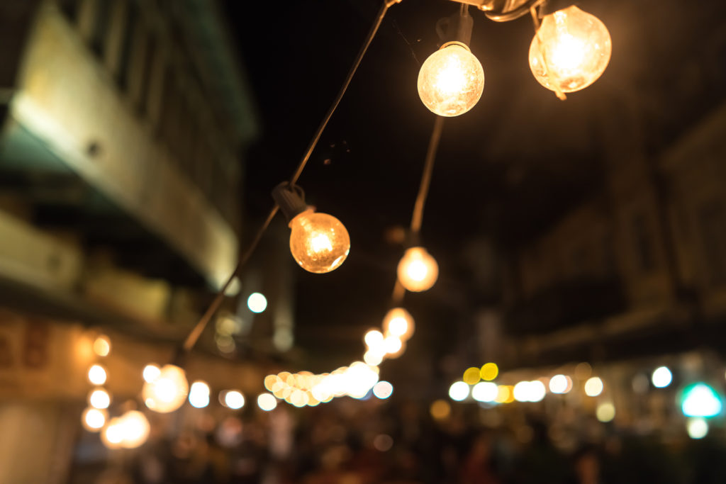 Blurred focus of a big city on light bulbs to show how you can improve focus in a camera as well as your life.